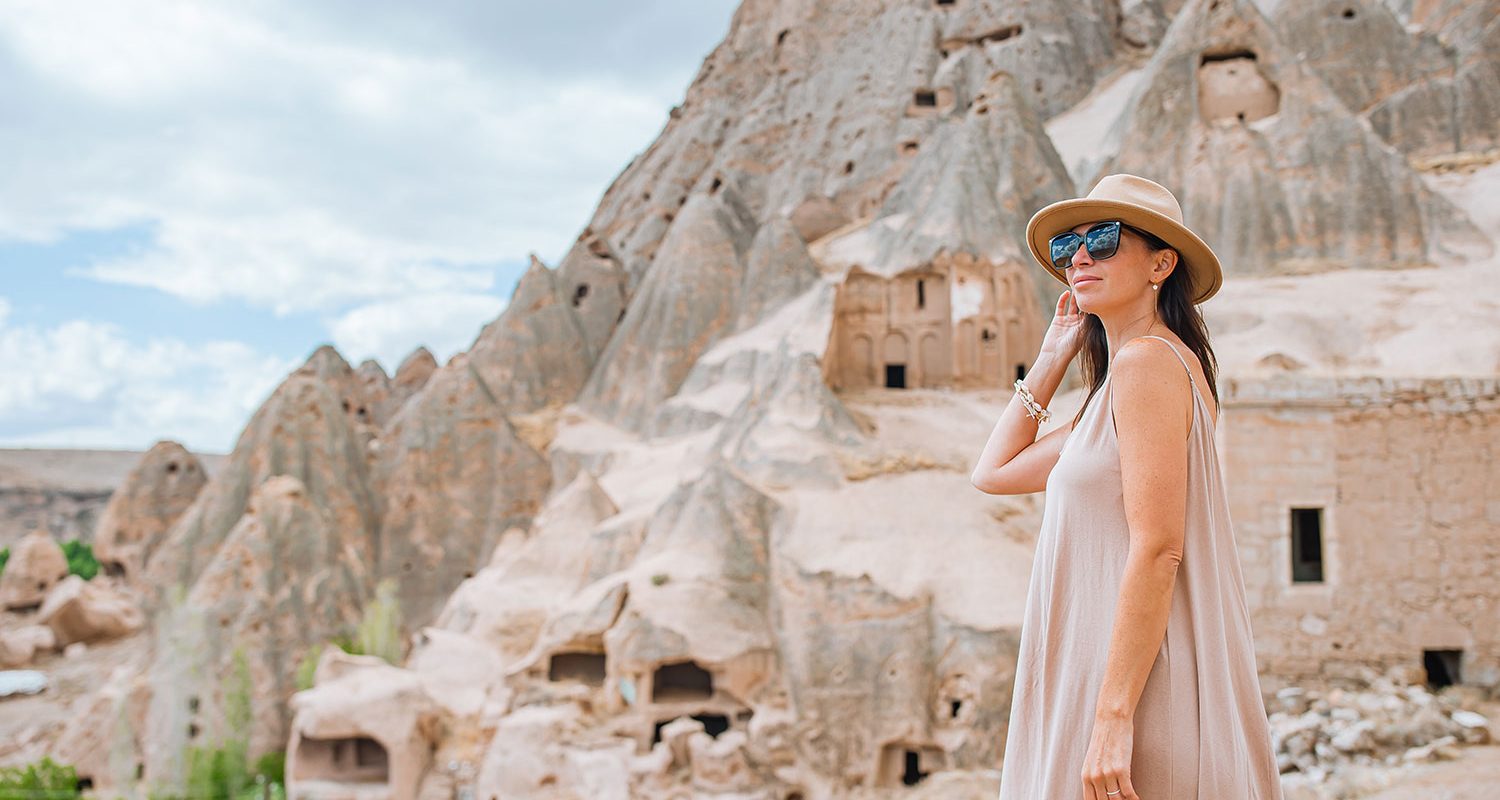 young-woman-on-the-edge-of-canyon-in-cappodocia-TYYWZ6D.jpg